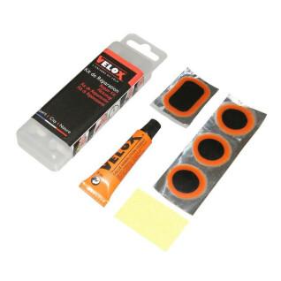 MTB binnenband reparatie kit - doos van 8 patches 25mm + 2 patches 35x25mm + 1 pacth 50x30mm + lijm 5g + stalen raap met instructies Velox